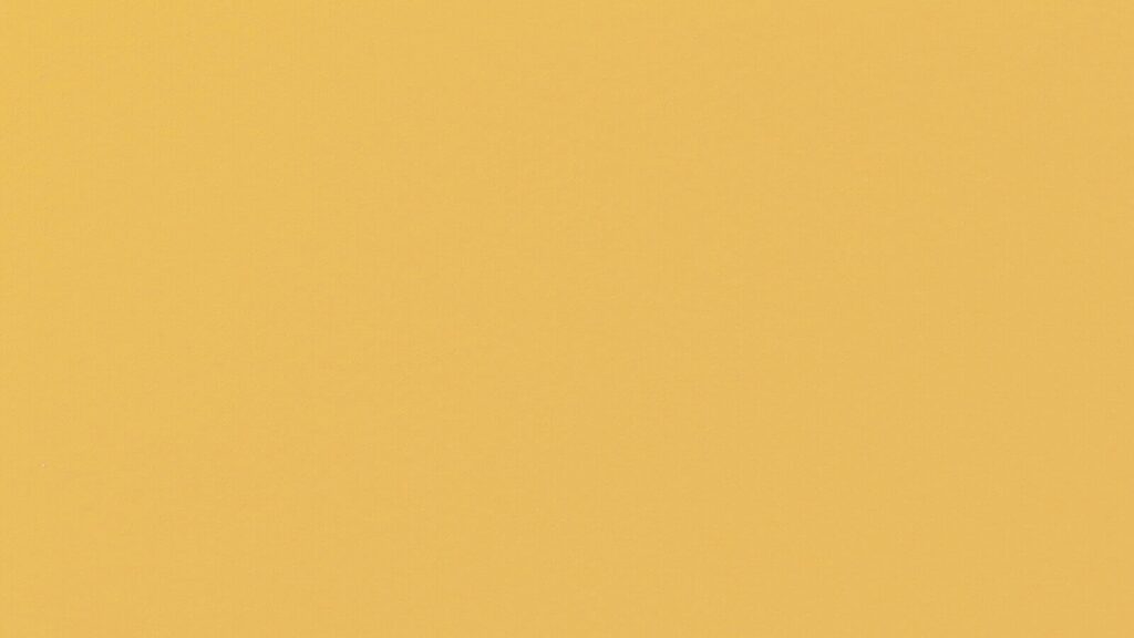 A solid yellow background with no visible patterns or objects.